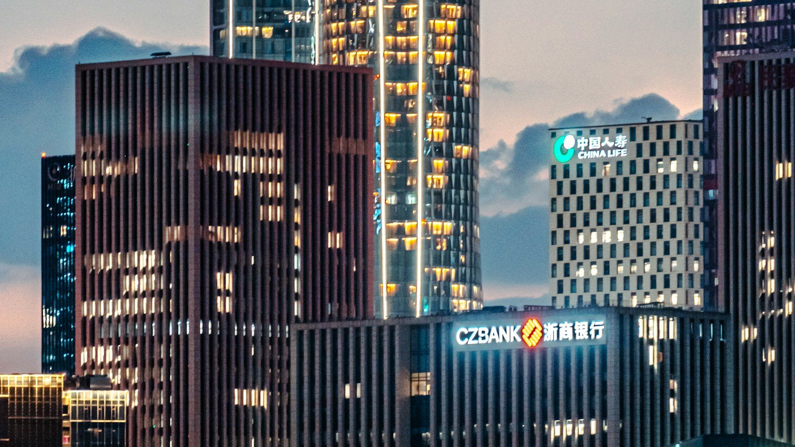 Modern skyscrapers illuminated at dusk
